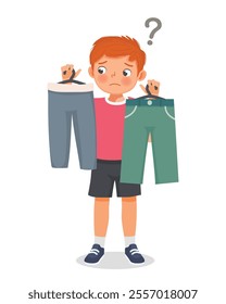 Cute little boy confused to choose clothes to wear