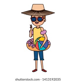 cute little boy with donut float and beach balloon