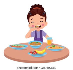 cute little boy eating at the dinner table