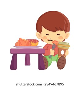 A cute little boy enjoying a pastry or snack with his coffee