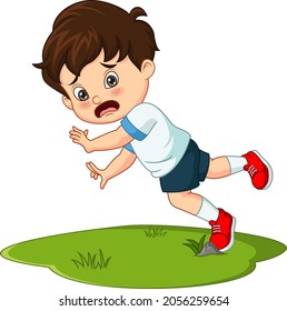 Cute little boy falling down in the grass