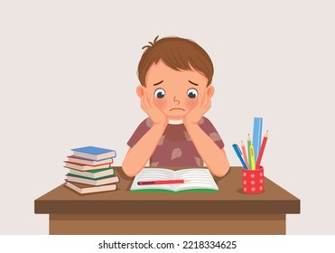 cute little boy feeling stress tired and bored studying doing homework on the desk