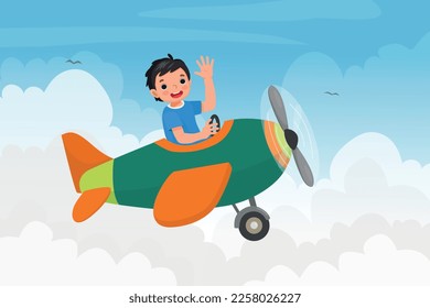 cute little boy flying an airplane waving hand in the blue sky