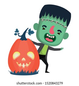 cute little boy with frankenstein costume and pumpkin