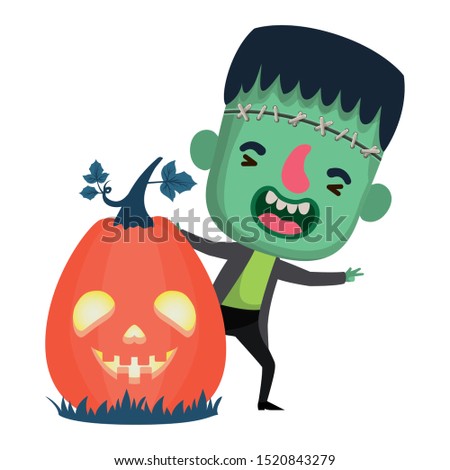 cute little boy with frankenstein costume and pumpkin