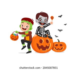 cute little boy and girl celebrate halloween with friend