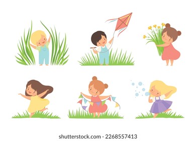 Cute Little Boy and Girl on Green Meadow Grass Vector Set