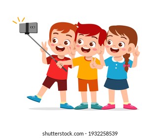 cute little boy and girl take selfie together