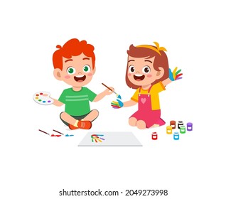 cute little boy and girl using paint to hand for art