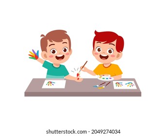 cute little boy and girl using paint to hand for art