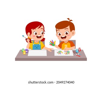 cute little boy and girl using paint to hand for art