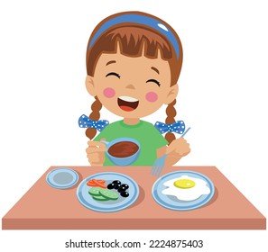 cute little boy having breakfast