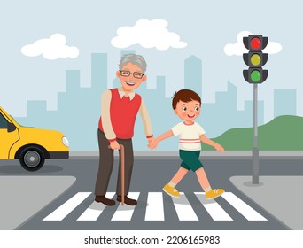 Cute little boy help elderly grandfather crossing street at the pedestrian traffic