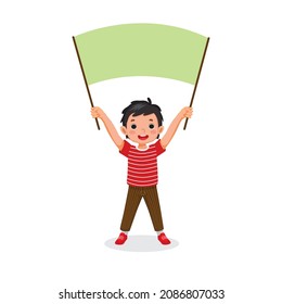 Cute little boy holding empty banner or sign board with  blank space for copy space, text, messages, and advertisement 