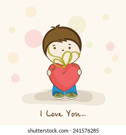 Cute little boy holding red heart shape balloon with text I Love You for Happy Valentine's Day celebration.