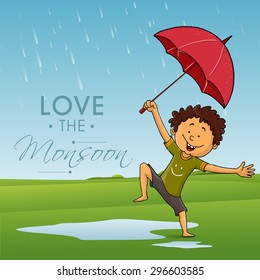 Cute little boy holding an umbrella and dancing in rains on nature background for Monsoon Season.