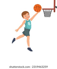 Cute little boy jumping scoring a layup at basketball game