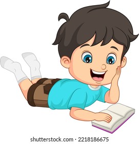 Cute little boy laying and reading a book