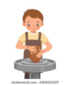 Cute little boy  making ceramic pot on pottery wheel in a workshop