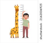 Cute Little boy measuring height of her growth on the background of wall with giraffe