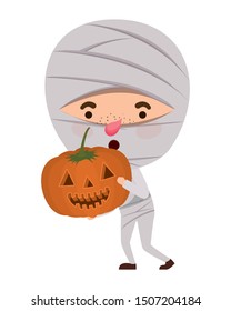 cute little boy with mummy costume and pumpkin