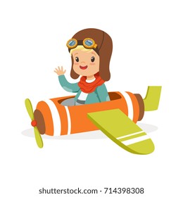 Cute little boy in pilot costume flying toy plane, kid dreaming of piloting the plane vector Illustration