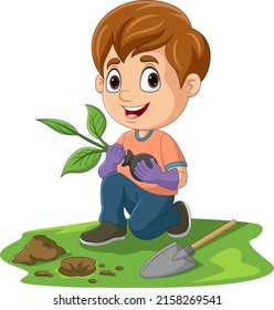 Cute little boy planting a plant