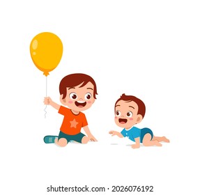 cute little boy play balloon with baby sibling