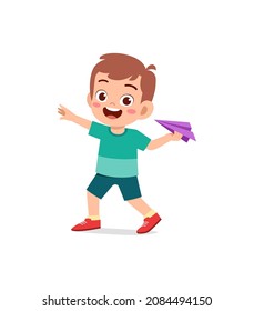 cute little boy play paper plane and feel happy