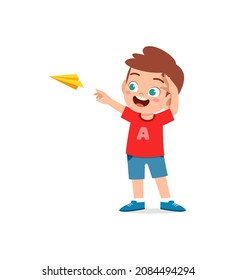 cute little boy play paper plane and feel happy