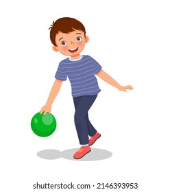 cute little boy playing bowling in the sport club ready to throw the ball