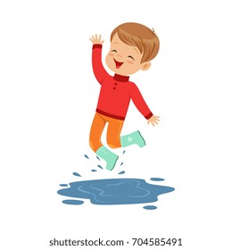 Cute little boy playing on a puddle wearing rubber boots cartoon vector Illustration
