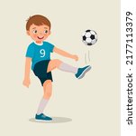 cute little boy playing soccer kicking the football