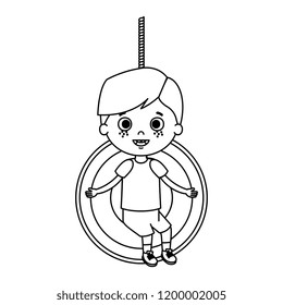 cute little boy playing in swing