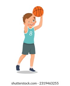 Cute little boy ready to shoot basketball at the rim