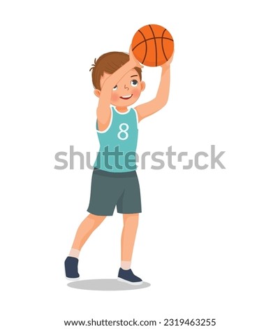 Cute little boy ready to shoot basketball at the rim
