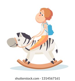 Cute little boy riding on the carousel horse, kid have a fun