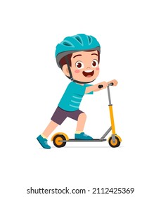 cute little boy riding scooter and wear helmet