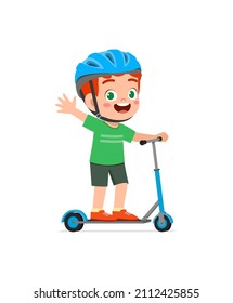 cute little boy riding scooter and wear helmet