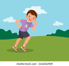 Cute little boy running jogging on the park on summertime