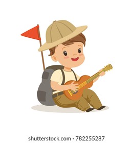 Cute little boy in scout costume playing guitar, outdoor camp activity vector Illustration