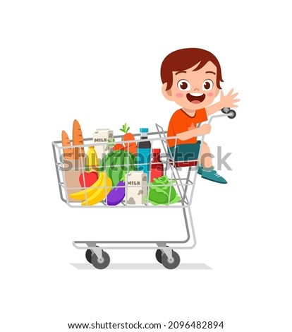 cute little boy sit on shopping cart