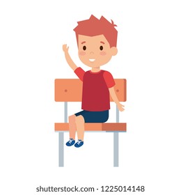 cute little boy sitting in schoolchair
