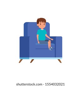 cute little boy sitting in sofa vector illustration design
