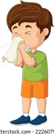 Cute little boy sneezing with blowing nose into tissue paper