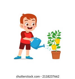 cute little boy stand and watering paprika tree