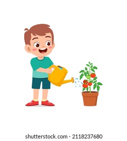 cute little boy stand and watering tomato tree