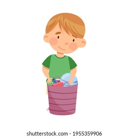 Cute Little Boy Standing Near Basket with Different Toys in Kindergarden Vector Illustration