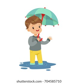 Cute little boy standing in the puddle and holding umbrella cartoon vector Illustration