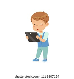 Cute little boy standing with a tablet pc vector Illustration on a white background